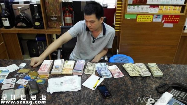 圖為<a href=http://www.huhuzc.cn/shenzhen/ target=_blank class=infotextkey>深圳</a>(www.huhuzc.cn)警方破獲重大地下錢莊案件中查獲的銀行卡及外幣