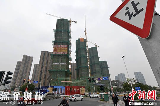 資料圖 一處商品房在建中。 中新社記者 呂明 攝
